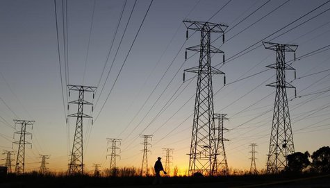 A man walks past electricity pylons as he returns from work in Soweto, outside Johannesburg May 15, 2012. REUTERS/Siphiwe Sibeko A man walks past electricity pylons as he returns from work in Soweto, outside Johannesburg May 15, 2012. REUTERS/Siphiwe Sibeko