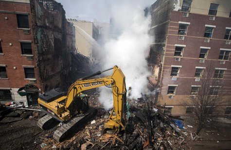 New York City emergency responders search through the rubble at the site of a building explosion in the Harlem section of New York, March 13 New York City emergency responders search through the rubble at the site of a building explosion in the Harlem section of New York, March 13