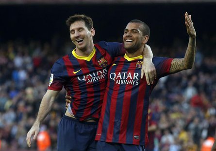 Barcelona's Lionel Messi (L) and Dani Alves celebrate a goal against Osasuna during the Spanish first division soccer match at Camp Nou stad Barcelona's Lionel Messi (L) and Dani Alves celebrate a goal against Osasuna during the Spanish first division soccer match at Camp Nou stad