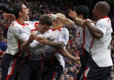 Liverpool's Steven Gerrard (2nd L) celebrates scoring his second penalty against Manchester United with team mates during their English Prem Liverpool's Steven Gerrard (2nd L) celebrates scoring his second penalty against Manchester United with team mates during their English Prem