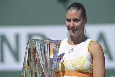 Mar 16, 2014; Indian Wells, CA, USA; Flavia Pennetta (ITA) with the championship trophy after winning final match against Agnieszka Radwansk Mar 16, 2014; Indian Wells, CA, USA; Flavia Pennetta (ITA) with the championship trophy after winning final match against Agnieszka Radwansk