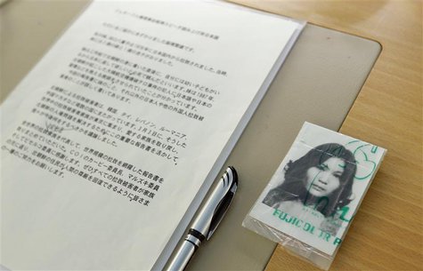 A picture of abduction victim Yaeko Taguchi lays next to the text of her brother Shigeo Izuka, a representative of the Association of the Fa A picture of abduction victim Yaeko Taguchi lays next to the text of her brother Shigeo Izuka, a representative of the Association of the Fa