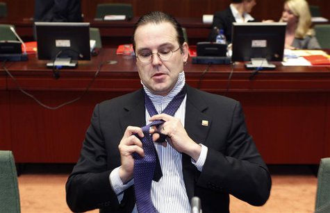 Sweden's Finance Minister Anders Borg adjusts his tie at the start of an European Union finance ministers meeting at the EU Council in Bruss Sweden's Finance Minister Anders Borg adjusts his tie at the start of an European Union finance ministers meeting at the EU Council in Bruss