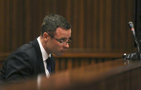 Olympic and Paralympic track star Oscar Pistorius takes notes as he sits in the dock during his trial for the murder of his girlfriend Reeva Olympic and Paralympic track star Oscar Pistorius takes notes as he sits in the dock during his trial for the murder of his girlfriend Reeva