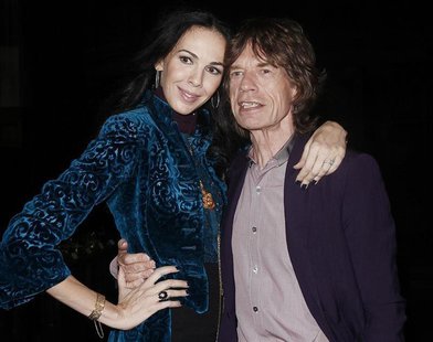 Musician Mick Jagger and designer L'Wren Scott pose following her Fall/Winter 2012 collection during New York Fashion Week, February 16, 201 Musician Mick Jagger and designer L'Wren Scott pose following her Fall/Winter 2012 collection during New York Fashion Week, February 16, 201