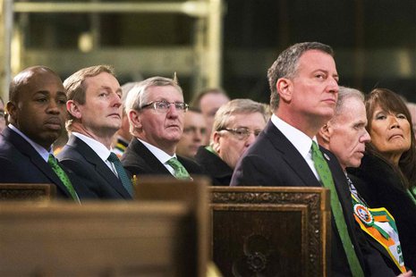 Northern Ireland First Minister Peter Robinson (2nd L) sits with New York Mayor Bill de Blasio (3rd R) during a service at Saint Patrick's C Northern Ireland First Minister Peter Robinson (2nd L) sits with New York Mayor Bill de Blasio (3rd R) during a service at Saint Patrick's C