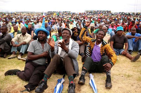 Miners gather at Wonderkop stadium outside the Lonmin mine in Rustenburg, northwest of Johannesburg January 30, 2014. REUTERS/Siphiwe Sibeko Miners gather at Wonderkop stadium outside the Lonmin mine in Rustenburg, northwest of Johannesburg January 30, 2014. REUTERS/Siphiwe Sibeko