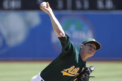Oakland Athletics starting pitcher Jarrod Parker delivers a pitch against the Texas Rangers during the first inning of their the MLB America Oakland Athletics starting pitcher Jarrod Parker delivers a pitch against the Texas Rangers during the first inning of their the MLB America