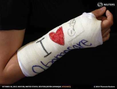 Cathey Park of Cambridge, Massachusetts shows her cast signed by U.S. President Barack Obama after he spoke about health insurance at Faneui Cathey Park of Cambridge, Massachusetts shows her cast signed by U.S. President Barack Obama after he spoke about health insurance at Faneui