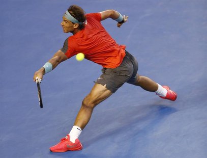 Rafael Nadal of Spain hits a return to Stanislas Wawrinka of Switzerland during their men's singles final match at the Australian Open 2014 Rafael Nadal of Spain hits a return to Stanislas Wawrinka of Switzerland during their men's singles final match at the Australian Open 2014