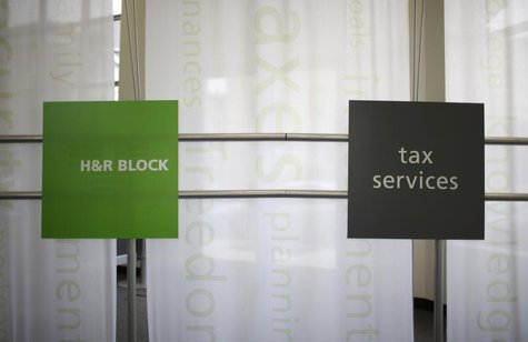 Signs at a H&R Block office are seen in Chicago April 14, 2009. REUTERS/John Gress Signs at a H&R Block office are seen in Chicago April 14, 2009. REUTERS/John Gress