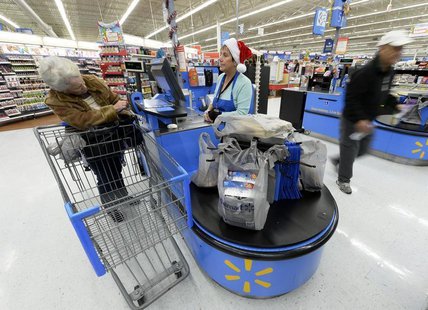 Customers shop at the Wal-Mart Supercenter in the Porter Ranch section of Los Angeles November 26, 2013. REUTERS/Kevork Djansezian Customers shop at the Wal-Mart Supercenter in the Porter Ranch section of Los Angeles November 26, 2013. REUTERS/Kevork Djansezian