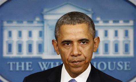 U.S. President Barack Obama pauses while speaking about the crisis in Ukraine from the White House in Washington March 17, 2014. REUTERS/Kev U.S. President Barack Obama pauses while speaking about the crisis in Ukraine from the White House in Washington March 17, 2014. REUTERS/Kev
