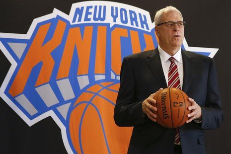Phil Jackson poses during a news conference announcing him as the team president of the New York Knicks basketball team at Madison Square Ga Phil Jackson poses during a news conference announcing him as the team president of the New York Knicks basketball team at Madison Square Ga