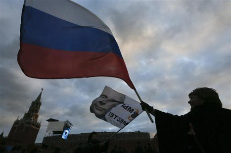 People attend a rally called "We are together" to support the annexation of Ukraine's Crimea to Russia in Red Square in central Moscow, Marc People attend a rally called "We are together" to support the annexation of Ukraine's Crimea to Russia in Red Square in central Moscow, Marc