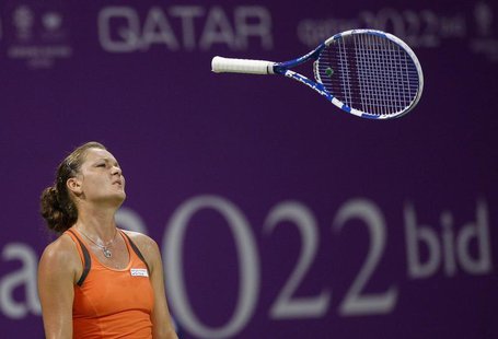 Agnieszka Radwanska of Poland throws her racket during her WTA Tour Championships tennis match against Victoria Azarenka of Belarus in Doha Agnieszka Radwanska of Poland throws her racket during her WTA Tour Championships tennis match against Victoria Azarenka of Belarus in Doha