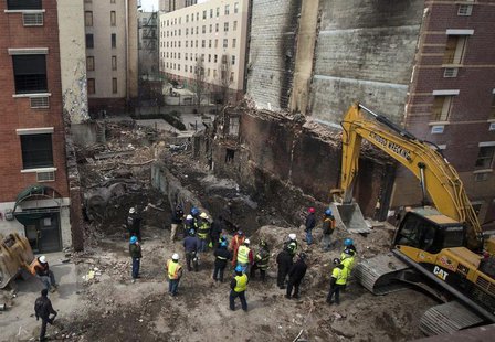 New York City emergency responders search through the rubble at the site of a building explosion in the Harlem section of New York, March 16 New York City emergency responders search through the rubble at the site of a building explosion in the Harlem section of New York, March 16