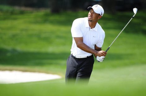 Tiger Woods of the U.S. reacts to his shot on the fifth hole during third round play in the Arnold Palmer Invitational PGA golf tournament i Tiger Woods of the U.S. reacts to his shot on the fifth hole during third round play in the Arnold Palmer Invitational PGA golf tournament i