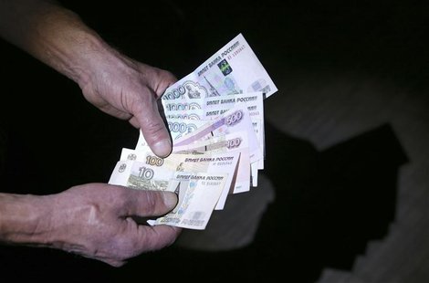 Russian roubles are seen in this photo illustration taken in Moscow, March 7, 2014. REUTERS/Sergei Karpukhin Russian roubles are seen in this photo illustration taken in Moscow, March 7, 2014. REUTERS/Sergei Karpukhin