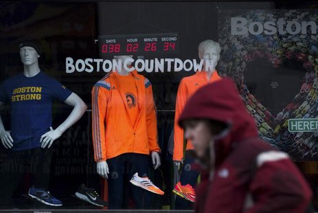 A digital clock on an athletic store front near the finish of the Boston Marathon, counts down the time to the 118th running of the Boston M A digital clock on an athletic store front near the finish of the Boston Marathon, counts down the time to the 118th running of the Boston M