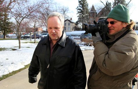 William Melchert-Dinkel (L) is photographed by a news cameraman as he walks to the Rice County Courthouse to enter a not guilty plea in a ca William Melchert-Dinkel (L) is photographed by a news cameraman as he walks to the Rice County Courthouse to enter a not guilty plea in a ca