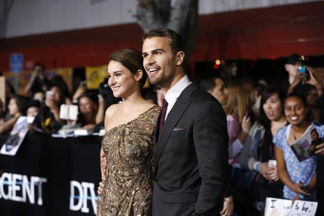 Cast members Shailene Woodley and Theo James pose at the premiere of "Divergent" in Los Angeles, California, March 18, 2014. REUTERS/Mario A Cast members Shailene Woodley and Theo James pose at the premiere of "Divergent" in Los Angeles, California, March 18, 2014. REUTERS/Mario A
