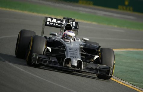 McLaren Formula One driver Jenson Button of Britain takes a corner during the Australian F1 Grand Prix at the Albert Park circuit in Melbour McLaren Formula One driver Jenson Button of Britain takes a corner during the Australian F1 Grand Prix at the Albert Park circuit in Melbour