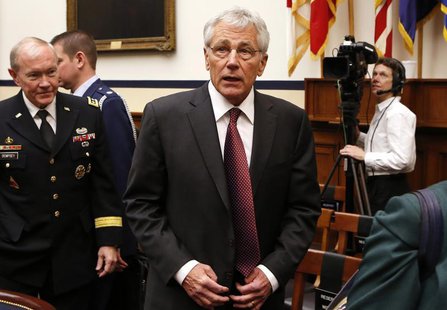 U.S. Secretary of Defense Chuck Hagel (C) and Chairman of the Joint Chiefs of Staff U.S. Army General Martin Dempsey (L) attend the House Ar U.S. Secretary of Defense Chuck Hagel (C) and Chairman of the Joint Chiefs of Staff U.S. Army General Martin Dempsey (L) attend the House Ar