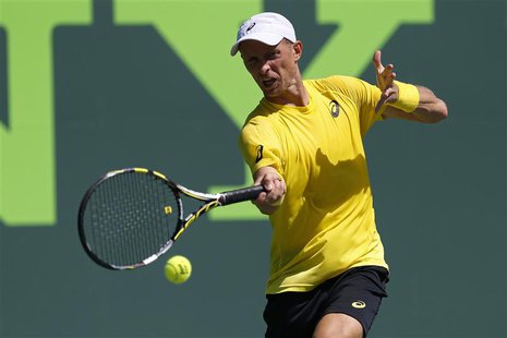 Mar 19, 2014; Miami, FL, USA; Nikolay Davydenko hits a forehand against Adrian Mannarino (not pictured) on day three of the Sony Open at Cra Mar 19, 2014; Miami, FL, USA; Nikolay Davydenko hits a forehand against Adrian Mannarino (not pictured) on day three of the Sony Open at Cra