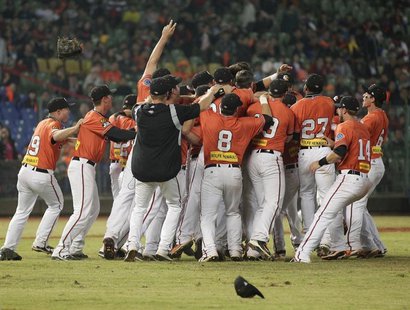 Australia's Canberra Cavalry players celebrate after defeating Taiwan's Uni-President 7-Eleven Lions 14-4 during their Asia Series 2013 base Australia's Canberra Cavalry players celebrate after defeating Taiwan's Uni-President 7-Eleven Lions 14-4 during their Asia Series 2013 base