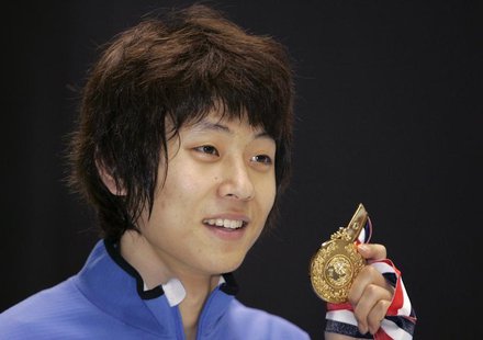 South Korea's Ahn Hyun-Soo poses with his gold medal after winning the men's 1500 metres event of the ISU World Cup Short Track in Kobe, wes South Korea's Ahn Hyun-Soo poses with his gold medal after winning the men's 1500 metres event of the ISU World Cup Short Track in Kobe, wes