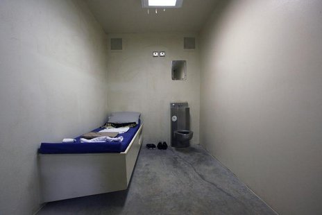 The interior of an unoccupied cell showing standard issue clothing given to prisoners is seen at Camp VI, a prison used to house detainees a The interior of an unoccupied cell showing standard issue clothing given to prisoners is seen at Camp VI, a prison used to house detainees a