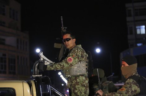 Afghan security personnel arrive at the site of an attack in Kabul March 20, 2014. REUTERS/Mohammad Ismail Afghan security personnel arrive at the site of an attack in Kabul March 20, 2014. REUTERS/Mohammad Ismail
