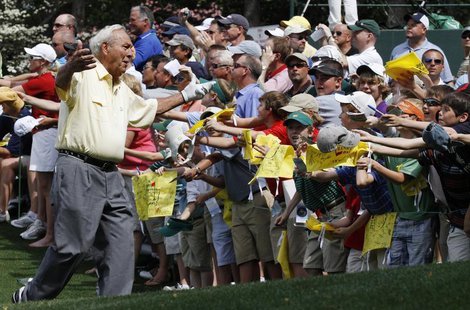 Golf great Arnold Palmer reacts to the fans during the Par 3 contest before the 2010 Masters golf tournament at the Augusta National Golf Cl Golf great Arnold Palmer reacts to the fans during the Par 3 contest before the 2010 Masters golf tournament at the Augusta National Golf Cl