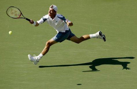 Lleyton Hewitt of Australia returns to Younes El Aynaoui of Morocco during their match at the U.S. Open in Flushing, New York, September 4, Lleyton Hewitt of Australia returns to Younes El Aynaoui of Morocco during their match at the U.S. Open in Flushing, New York, September 4,