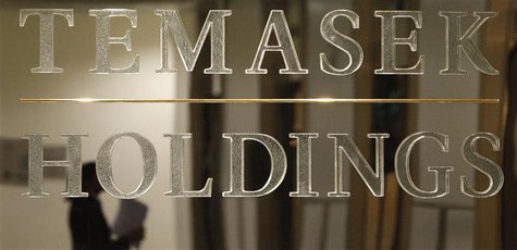 A staff member is reflected in a Temasek Holdings logo at their headquarters before the presentation of Temasek's annual review in Singapore A staff member is reflected in a Temasek Holdings logo at their headquarters before the presentation of Temasek's annual review in Singapore