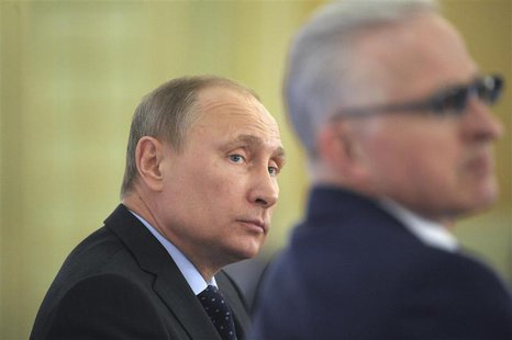 Russian President Vladimir Putin (L) attends a business conference in Moscow March 20, 2014. REUTERS/Alexei Druzhinin/RIA Novosti/Kremlin Russian President Vladimir Putin (L) attends a business conference in Moscow March 20, 2014. REUTERS/Alexei Druzhinin/RIA Novosti/Kremlin