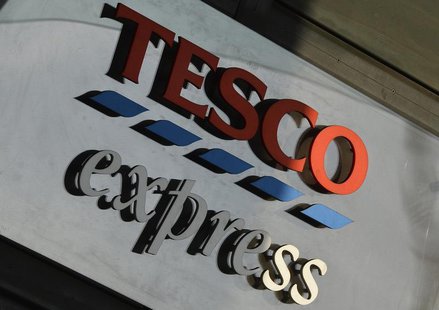 A Tesco logo is seen on a branch of the Tesco Express convenience store in central London December 12, 2013. REUTERS/Toby Melville A Tesco logo is seen on a branch of the Tesco Express convenience store in central London December 12, 2013. REUTERS/Toby Melville