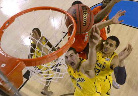 Michigan going for the dunk. REUTERS/Daniel J. Beauvais. Michigan going for the dunk. REUTERS/Daniel J. Beauvais.