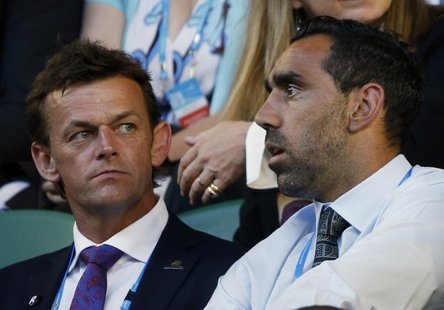 Australian cricketer Adam Gilchrist sits with Australian Football League (AFL) player Adam Goodes in the spectator stands ahead of the men's Australian cricketer Adam Gilchrist sits with Australian Football League (AFL) player Adam Goodes in the spectator stands ahead of the men's