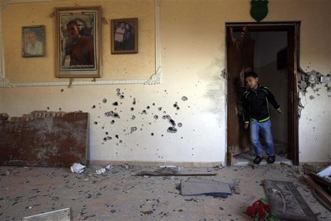 A boy walks out of a door in the house where Palestinian Hamas militant Hamza Abu Alhija was killed in the West Bank refugee camp of Jenin M A boy walks out of a door in the house where Palestinian Hamas militant Hamza Abu Alhija was killed in the West Bank refugee camp of Jenin M