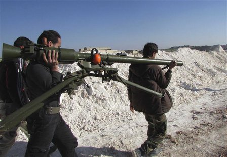 Free Syrian Army fighters carry a weapon in Sheikh Najjar in Aleppo March 20, 2014. REUTERS/Houssam Abo Dabak Free Syrian Army fighters carry a weapon in Sheikh Najjar in Aleppo March 20, 2014. REUTERS/Houssam Abo Dabak