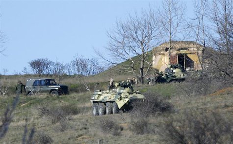Armed men, believed to be Russian servicemen, gather on a hill near a military base in the Crimean town of Belbek outside Sevastopol March 2 Armed men, believed to be Russian servicemen, gather on a hill near a military base in the Crimean town of Belbek outside Sevastopol March 2