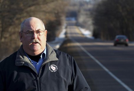 Retired Wisconsin State Trooper Keith Young stands on highway 40 in Elk Mound, Wisconsin March 22, 2014. REUTERS/Andy Clayton-King Retired Wisconsin State Trooper Keith Young stands on highway 40 in Elk Mound, Wisconsin March 22, 2014. REUTERS/Andy Clayton-King