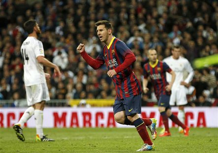 Barcelona's Lionel Messi celebrates after scoring a penalty against Real Madrid during La Liga's second 'classic' soccer match of the season Barcelona's Lionel Messi celebrates after scoring a penalty against Real Madrid during La Liga's second 'classic' soccer match of the season