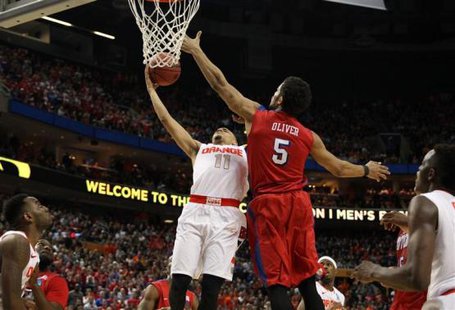 Syracuse Orange guard Tyler Ennis (11) misses a shot late as Dayton Flyers forward Devin Oliver (5) defends in the second half of a men's college basketball game during the third round of the 2014 NCAA Tournament at First Niagara Center. Timothy T. Ludwig-USA TODAY Sports Syracuse Orange guard Tyler Ennis (11) misses a shot late as Dayton Flyers forward Devin Oliver (5) defends in the second half of a men's college basketball game during the third round of the 2014 NCAA Tournament at First Niagara Center. Timothy T. Ludwig-USA TODAY Sports