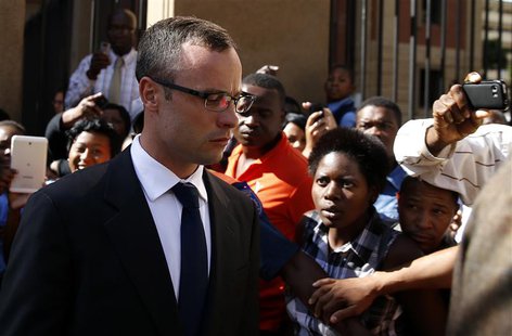 Olympic and Paralympic track star Oscar Pistorius (L) leaves after his trial for the murder of his girlfriend Reeva Steenkamp, at the North Olympic and Paralympic track star Oscar Pistorius (L) leaves after his trial for the murder of his girlfriend Reeva Steenkamp, at the North