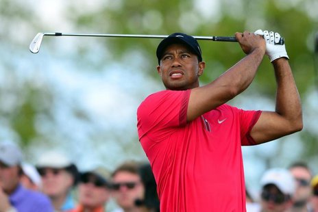 Mar 9, 2014; Miami, FL, USA; Tiger Woods tees off from the 4th hole during the final round of the WGC - Cadillac Championship golf tournamen Mar 9, 2014; Miami, FL, USA; Tiger Woods tees off from the 4th hole during the final round of the WGC - Cadillac Championship golf tournamen