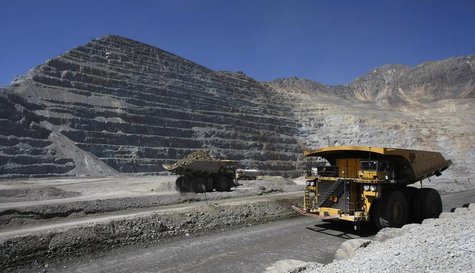 Trucks travel along roads at the Los Bronces copper mine, some 65 km (40 miles) northeast of Santiago city and 3500 meters above sea level i Trucks travel along roads at the Los Bronces copper mine, some 65 km (40 miles) northeast of Santiago city and 3500 meters above sea level i