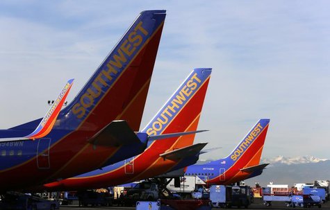Southwest Airlines jets wait on the tarmac at Denver International Airport in Denver January 22, 2014. REUTERS/Rick Wilking Southwest Airlines jets wait on the tarmac at Denver International Airport in Denver January 22, 2014. REUTERS/Rick Wilking